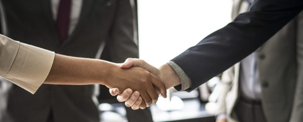 Business people shaking hands in a meeting room